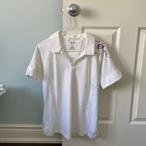 Adidas White golf shirt with orchid accent pattern over one shoulder